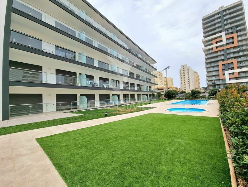 апартаменты T1 новые Portimão - бассейн, система кондиционирования, гараж, сады, солнечные панели, веранда, экипирован, частный кондоминиум