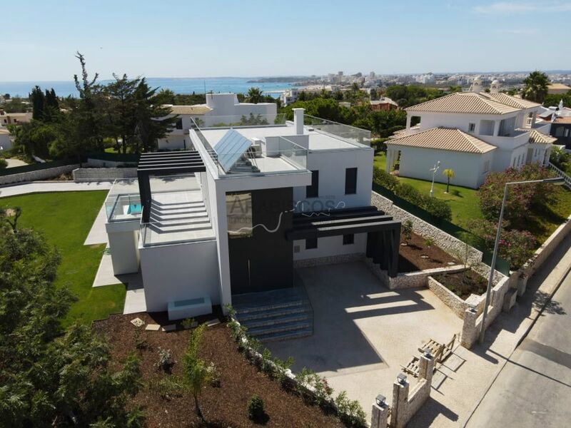 жилой дом новые V4 Lagoa - Ferragudo Lagoa (Algarve) - полы с подогревом, гараж, веранда, терраса, система кондиционирования, сигнализация, бассейн, вид на море, солнечная панель