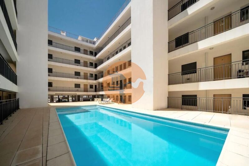 Apartment 2 bedrooms Olhão - gated community, double glazing, parking space, garage, kitchen, swimming pool