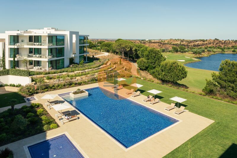 апартаменты T2 элитная в центре Monte Rei Golf & Country Club Vila Nova de Cacela Vila Real de Santo António - терраса, полы с подогревом, террасы, сады, бассейн